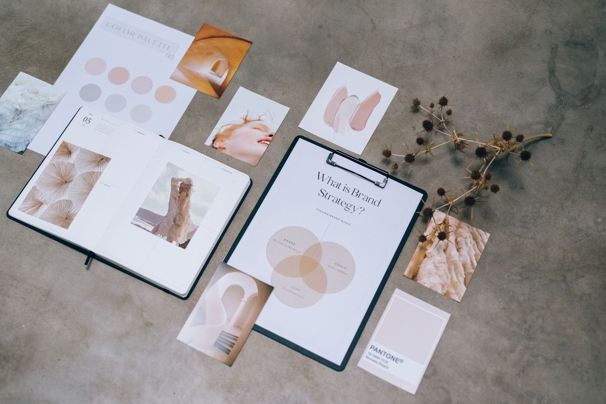 Designer at work with sketches and layouts on a desk