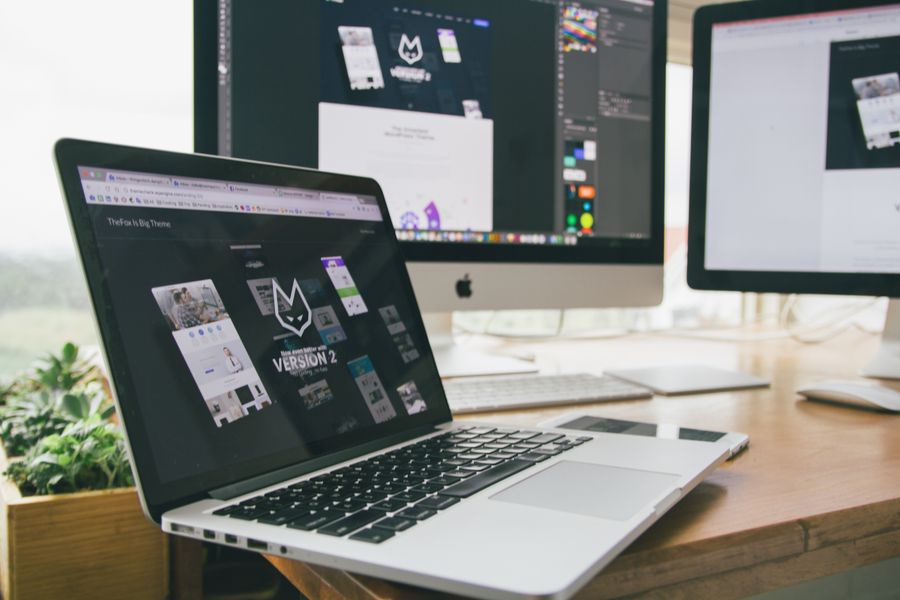 Design workspace with laptop and monitor